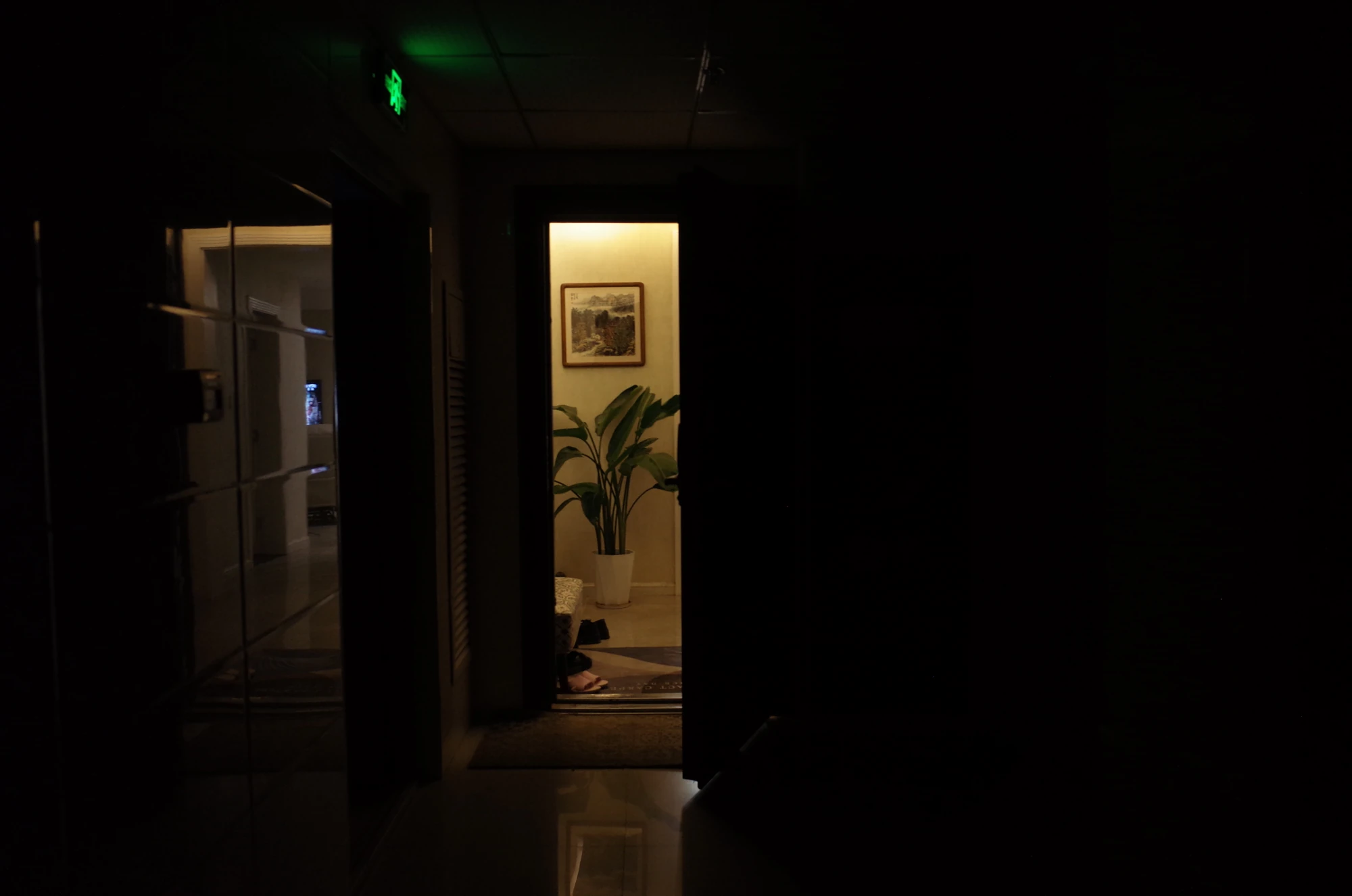 Illuminated doorway in darkness