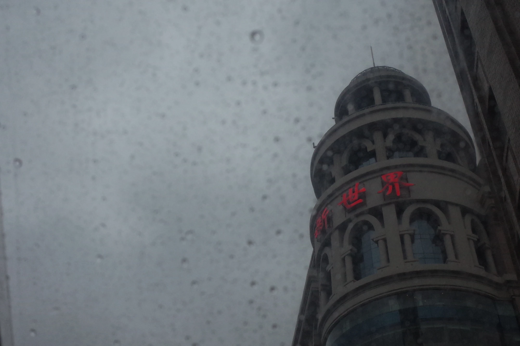 Tower rising through a pale sky